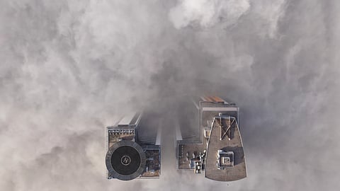 An aerial view of buildings peaking through a dense layer of fog in Sarajevo, Bosnia, Thursday, Dec 18, 2025.
