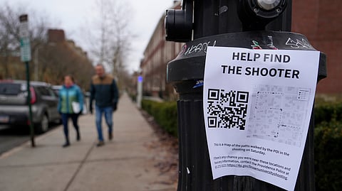 A poster seeking information about the campus shooting suspect is seen on the campus of Brown University, Wednesday, Dec. 17, 2025, in Providence, RI. 