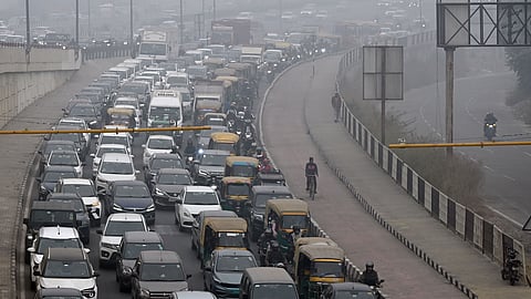 Traffic jam during Traffic police personnel stop a vehicle for document verification at the Delhi- UP Border (Ghazipur), in New Delhi, Thursday, Dec. 18, 2025