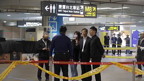 Taiwan police cordoned off the scene after a knife attack in Taipei, Taiwan, Friday, Dec. 19, 2025.
