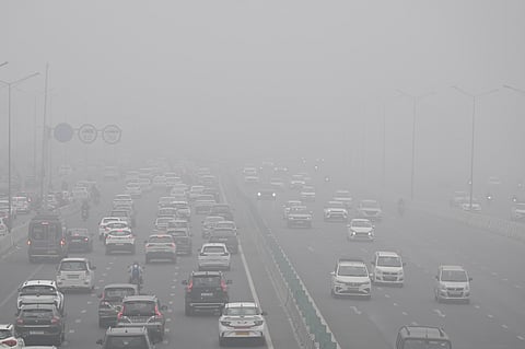 Vehicles ply on road on a foggy winter morning, in New Delhi, Thursday, Dec. 18, 2025. Dense fog enveloped large parts of Delhi-NCR on Thursday morning, significantly reducing visibility and disrupting normal movement across the national capital. 