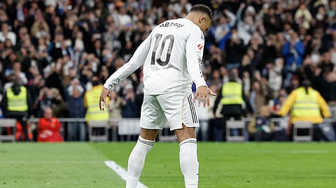 Real Madrid's Kylian Mbappe celebrates scoring his team's second goal during the Spanish league football match between Real Madrid CF and Sevilla FC at Santiago Bernabeu Stadium in Madrid on December 20, 2025. 