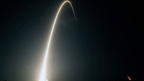 In this time-exposure photograph, a SpaceX Falcon 9 rocket with the 25th batch of approximately 60 satellites for SpaceX's Starlink broadband network lifts off from the Space Launch Complex 40 at the Cape Canaveral Space Force Station in Cape Canaveral, Fla., late Wednesday, April 28, 2021.