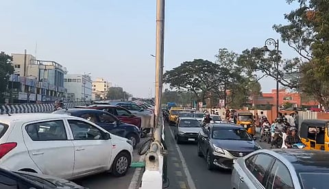 Unable to find parking spaces at Semmozhi Poonga in Gandhipuram, Coimbatore, on Sunday evening, many people used the nearby Gandhipuram flyover as a makeshift parking area. 