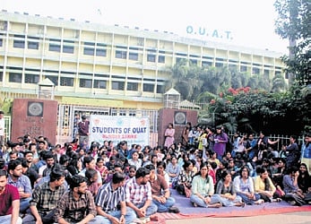 Students protesting in front of OUAT main gate on Monday.