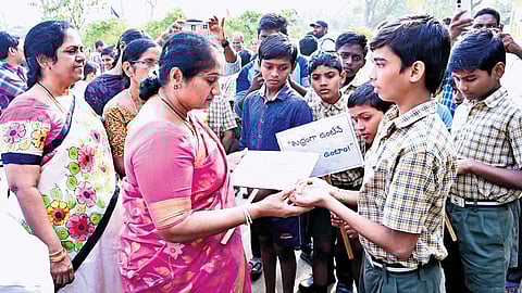 Minister for BC Welfare S Savita interacts with Gurukul School students.