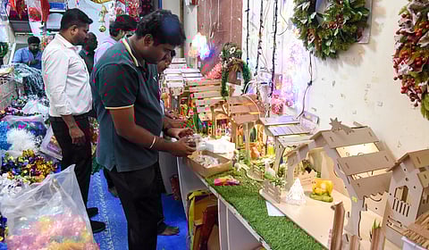 A man purchasing a detachable crib house at Allimal Street in Tiruchy