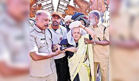 102-year-old Parukkutty after ascending the 18 sacred steps at Sabarimala