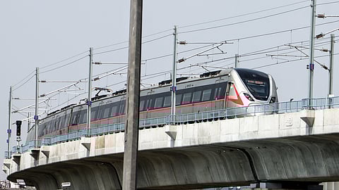 The Rapid Metro runs over metro flyover at Sarai Kale Khan, in New Delhi