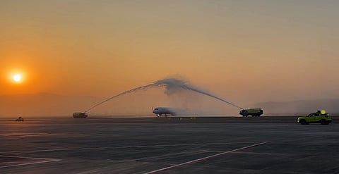 An aircraft accorded a ceremonial water cannon salute as Navi Mumbai International Airport commenced commercial flight operations, Thursday, Dec. 25, 2025.
