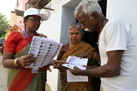  A Booth Level Officer (BLO) verifies voter details during the Special Intensive Revision (SIR) of electoral rolls in Thiruvananthapuram