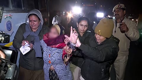 Delhi police detain the mother of the Unnao rape case victim as she protests against the Delhi High Court's order suspending the sentence of convict Kuldeep Singh Sengar at India Gate in New Delhi on Tuesday.