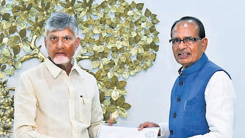 Chief Minister N Chandrababu Naidu submits a representation to Union Agriculture Minister Shivraj Singh Chouhan on Thursday.