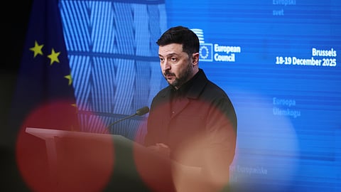 Ukraine's President Volodymyr Zelenskyy addresses a media conference during the EU Summit in Brussels, Thursday, Dec. 18, 2025.