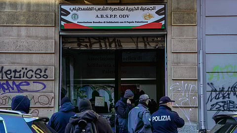 Police officers inspect a charitable association supporting Palestinian civilians in Milan, Italy, Saturday, Dec. 27, 2025 after Italian investigators have arrested nine people suspected of raising millions of euros for Hamas.
