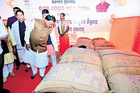 CM Mohan Charan Majhi inspecting paddy bags at Palasapanga LAMPS in Keonjhar