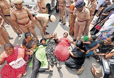 Sanitary workers who staged a protest demanding job regularisation were detained by the police near the Madras High Court on Saturday 