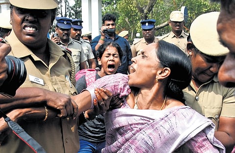 Police forcibly removed members of the Secondary Grade Seniority Teachers Association who attempted to block the road outside the Directorate of Public Instruction office at Nungambakkam, Chennai, on Friday