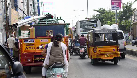 A commercial goods vehicle moving amid traffic in Tiruchy.