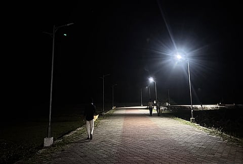 The partially lit walkway stretch at the Karaikal beach.