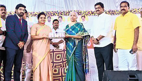 West Godavari District Collector C Nagarani presenting a memento to Union Finance Minister Nirmala Sitharaman.