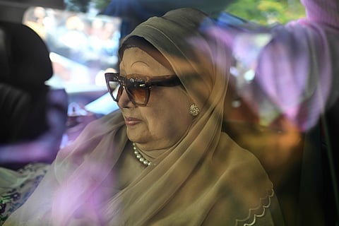 Former Bangladesh Prime Minister Khaleda Zia waves to supporters after she was arrested in Dhaka, Bangladesh, on Sept. 3, 2007.
