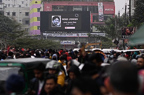 Former Bangladesh Prime Minister Khaleda Zia waves to supporters after she was arrested in Dhaka, Bangladesh, on Sept. 3, 2007.