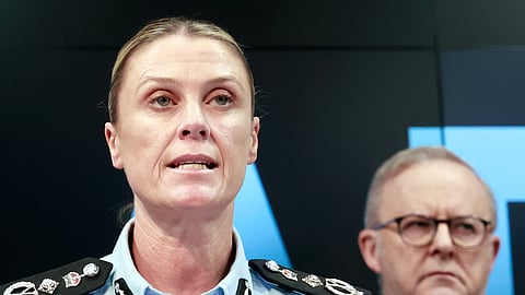 Australian Federal Police Commissioner Krissy Barrett speaks about the Bondi terror attack investigation as Prime Minister Anthony Albanese, right, listens, Tuesday, Dec. 30, 2025, in Canberra, Australia. 