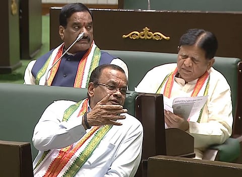 Minister Komatireddy Venkat Reddy interacts with Congress MLA Sudharsan Reddy during the session on Monday.