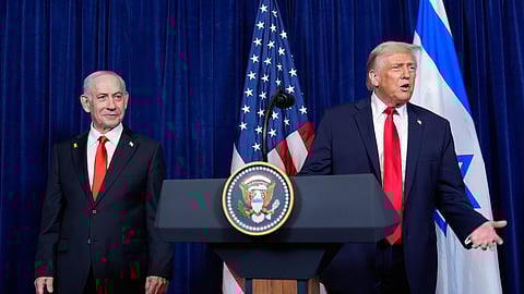 President Donald Trump answers a question from a reporter at the end of a news conference with Israel's Prime Minister Benjamin Netanyahu at Mar-a-Lago, Monday, Dec. 29, 2025, in Palm Beach, Fla. 