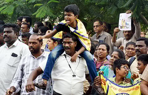 Members of the SSTA  stage a protest on the Gandhi Irwin flyover in Egmore on Tuesday.  