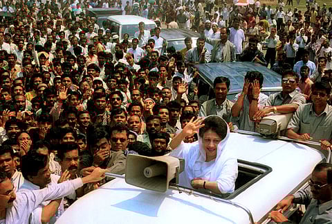 Former Bangladesh Prime Minister Khaleda Zia waves to supporters after she was arrested in Dhaka, Bangladesh, on Sept. 3, 2007.