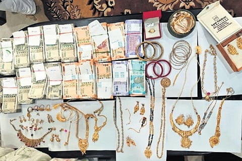 Cash and valuables seized during Vigilance raids on Barang additional tehsildar