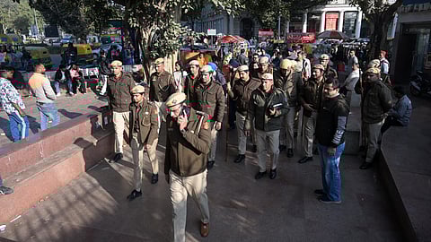 Delhi police officials patrol and impose restrictions during New Years Eve at Connaught Place in New Delhi on Tuesday.