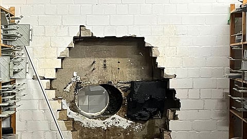 This picture, provided by the Gelsenkirchen Police on Monday, Dec. 29, 2025 shows a hole in a wall of the savings bank branch in the Buer district in Gelsenkirchen, Germany.