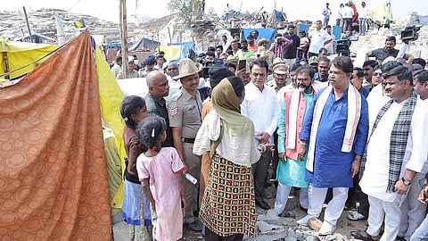 BJP leaders R Ashoka, Chalavadi Narayanaswamy, CN Ashwath Narayan and others interact with Kogilu residents on Wednesday