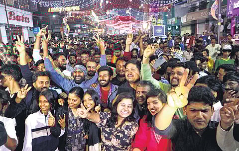 Brigade Road was the hub of NY celebrations; Below: Cops on their toes checking revellers.