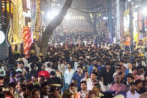 Thousands of people throng Kormangala for New Year celebrations.