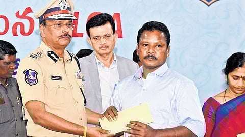Maoist Badse Deva surrenders before Telangana DGP B Shivadhar Reddy in Hyderabad on Saturday.