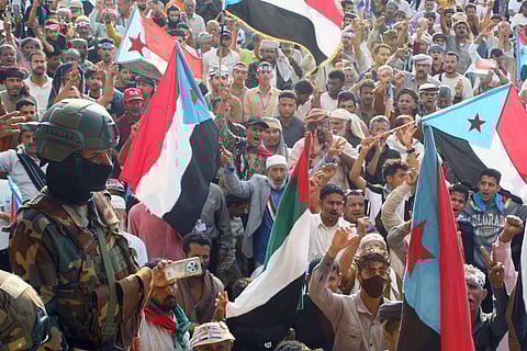 Supporters of the Southern Transitional Council, a coalition of separatist groups seeking to restore the state of South Yemen, hold South Yemen flags during a rally, in Aden, Yemen, Friday, Jan 2, 2026.