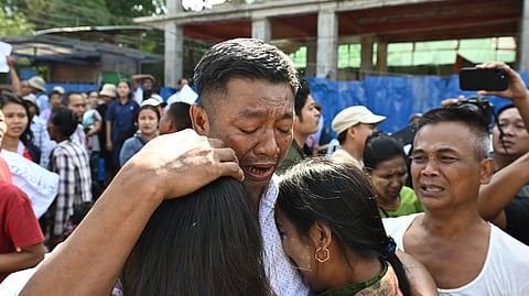 Relatives celebrate with a man after he was released during an annual amnesty to mark Myanmar's independence day outside Insein prison in Yangon on January 4, 2026.