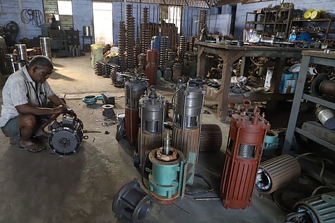 Labours at a pump set motor manufacturing industry in Coimbatore. 