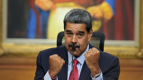 Venezuelan President Nicolas Maduro raises up his closed fists during a news conference at Miraflores presidential palace in Caracas, Venezuela, July 31, 2024, three days after his disputed reelection.