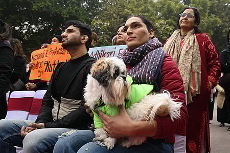 Activists during a protest against Supreme Court order on stray dog relocation at Jantar Mantar, in New Delhi, Sunday, Jan. 4, 2026.