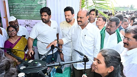 Agriculture, Marketing and Animal Husbandry Minister Kinjaraapu Achchennaidu pursuing agricultural technology material at Kodumur town on Saturday. 