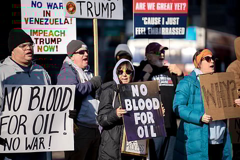 Protesters rally in front of the Ohio Statehouse in Columbus, Ohio, on Sunday, Jan. 4, 2026, after the U.S. captured Venezuelan President Nicolás Maduro and his wife in a military operation.