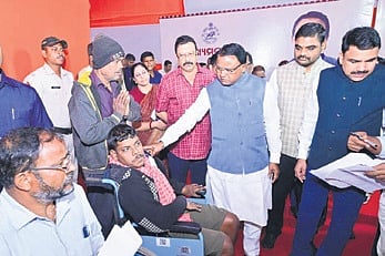 Chief Minister Mohan Charan Majhi listening to the grievance of a physically -challenged youth at the CM’s Grievance Cell, in Bhubaneswar on Monday
