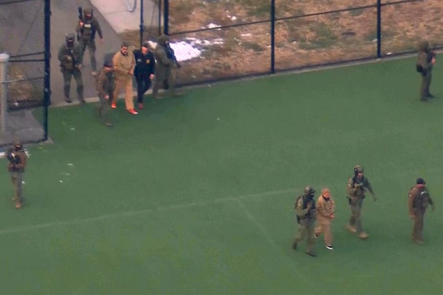 This image taken from video shows Venezuelan President Nicolas Maduro, top left, and his wife, Cilia Flores, bottom right, being escorted to board a helicopter for transport to Manhattan Federal Court, Monday, Jan. 5, 2026, in New York. 