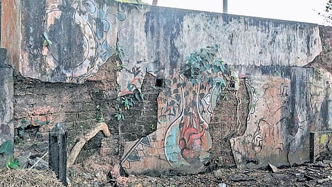 The walls of artillery bunker defaced by graffiti.