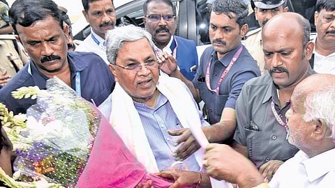 People greet Chief Minister Siddaramaiah in Mysuru on Tuesday.